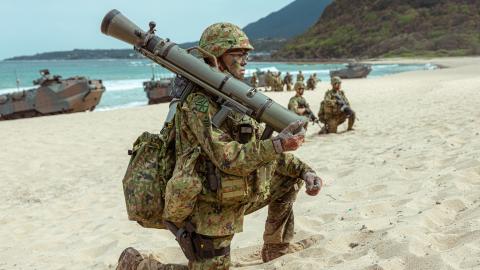 A soldier with the 1st Amphibious Rapid Deployment Regiment, Japan Ground Self-Defense Force provides security during a bilateral amphibious assault exercise with U.S. Marines from Battalion Landing Team 1/4, 31st Marine Expiditionay Unit, at Tokunoshima, Japan, March 3, 2023. The bilateral amphibious assault exercise allowed Marines and JGSDF soldiers to simultaneously secure austere terrain. during Iron Fist 23. Iron Fist is an annual bi-lateral exercise designed to increase interoperability and strengthe