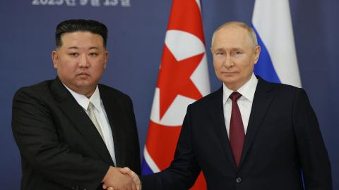 Russian President Vladimir Putin and North Korea's leader Kim Jong Un shaking hands on September 13, 2023. (Vladimir Smirnov/Pool/AFP via Getty Images)