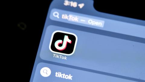 The logo of Chinese online social media and video hosting service TikTok is displayed on a smartphone screen (Alpha Photo via Flickr)