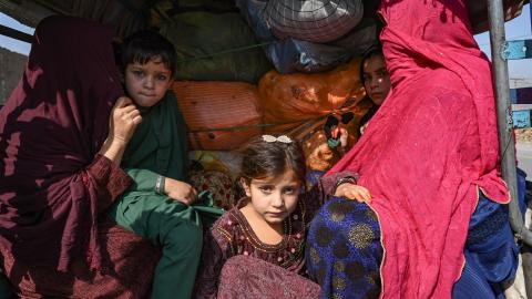 A family of Afghan nationals sit on a vehicle in Jamrud area of Khyber district on October 6, 2023. (Abdul Majeed/AFP via Getty Images)