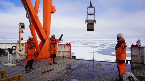 Members of China's thirteenth Arctic Ocean scientific expedition team conduct a sampling operation aboard China's polar icebreaker Xuelong 2 on August 6, 2023. (Wei Hongyi/Xinhua via Getty Images)