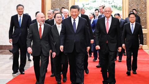 Chinese President Xi Jinping meets with representatives from the American business, strategic, and academic communities at the Great Hall of the People in Beijing on March 27, 2024. (Photo by Shen Hong via Getty Images)