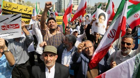 People march with flags and banners to celebrate Iran's attack on Israel on April 19, 2024, in Tehran, Iran. (Fatemeh Bahrami via Getty Images)