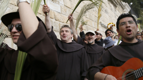 Franciscan fryers in the traditional Palm Sunday procession from Mt. Olives to Jerusalem's Old City on April 13, 2014. (GALI TIBBON/AFP/Getty Images)