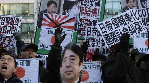 South Korean protesters shout slogans during a anti-Japan rally in front of the Japanese embassy on December 27, 2013 in Seoul, South Korea. (Chung Sung-Jun/Getty Images)