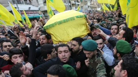 Lebanese Hezbollah supporters carry the coffin of militant Jihad Mughniyeh during his funeral in a southern Beirut suburb on January 19, 2015. (JOSEPH EID/AFP/Getty Images)