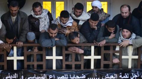 Egyptian Coptic Christians attend a memorial ceremony for relatives murdered by Islamic State group militants in Libya, on February 16, 2015, in the village of al-Awar in Egypt's southern province of Minya. (MOHAMED EL-SHAHED/AFP/Getty Images)