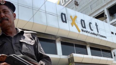 Pakistani security forces stands guard outside the headquarters of Axact, a software firm during raids by Federal Investigation Agency (FIA) in Karachi, Pakistan, on May 27, 2015. (Qaisar Khan/Anadolu Agency/Getty Images)