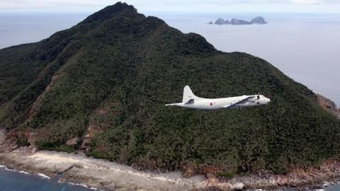 A P-3C patrol plane of Japanese Maritime Self-Defense Force flying over the Senkaku Islands/Diaoyu Islands in the East China Sea, October 13, 2011. (JAPAN POOL/AFP/Getty Images)