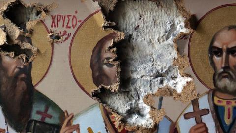 Damaged icons inside the church of the monastery of Saint Takla in the ancient Christian town of Maalula, May 14, 2014. (JOSEPH EID/AFP/Getty Images)