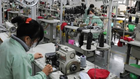 Workers sewing in a clothing factory in Bozhou, east China's Anhui province, November 16, 2013. (STR/AFP/Getty Images)