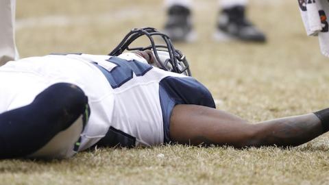 Marcus Trufant of the Seattle Seahawks lays on the ground after suffering a concussion against the Chicago Bears during the NFC Divisional playoff game at Soldier Field on January 16, 2011 in Chicago, Illinois. (Joe Robbins/Getty Images)