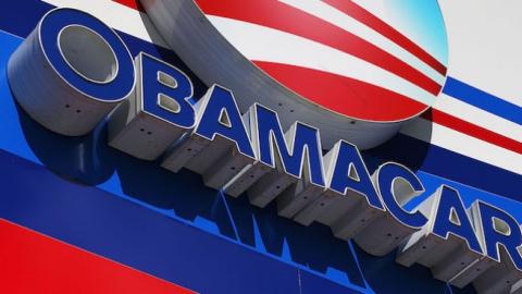 An Obamacare sign is seen on the UniVista Insurance company office on December 15, 2015 in Miami, Florida. (Joe Raedle/Getty Images)