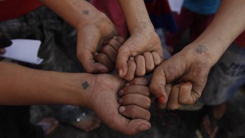 Atef's grandchildren present on their right wrist the tattoo of a blue cross, a sign of their belonging to the Copts of Egypt, Cairo, November 9, 2010. (Alvaro Canovas/Paris Match via Getty Images)