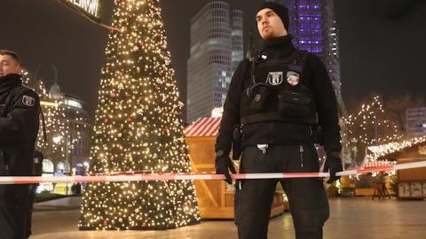 Police stand at the area after a lorry truck ploughed through a Christmas market on December 19, 2016 in Berlin, Germany. (Sean Gallup/Getty Images)