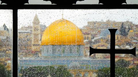 The "Dome of the Rock" is seen from the window of the Dominos Flevit Church on the Mount of Olives in Jerusalem. (GETTY IMAGES)