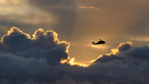 A military helicopter flies over the waters of Agana Bay in Hagatna, Guam, on Aug. 10, 2015. (Tiffany Tompkins-Condie/McClatchy DC/Tribune News Service via Getty Images)