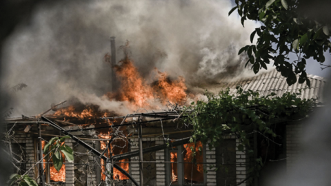 A house burns after being shelled during an artillery duel between Ukrainian and Russian troops in the city of Lysychansk, Ukraine, on June 11, 2022. (Photo by Aris Messinis/AFP via Getty Images)