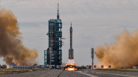 The manned Shenzhou-12 spacecraft onboard the Long March-2F rocket launches at the Jiuquan Satellite Launch Center on June 17, 2021, in Jiuquan, Gansu province, China. (Kevin Frayer/Getty Images)