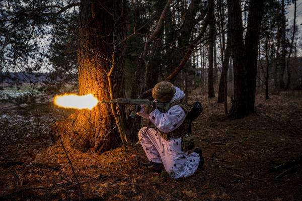 A Ukrainian serviceman fires during a joint military training of armed forces, national guards, border guards and Security Service of Ukraine in Rivne region, near the border with Belarus, on February 11, 2023, amid the Russian invasion of Ukraine. (Photo by Dimitar DILKOFF / AFP) (Photo by DIMITAR DILKOFF/AFP via Getty Images)