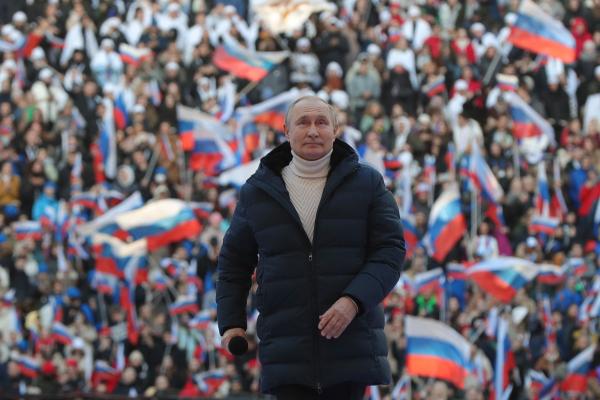 Russian President Vladimir Putin attends a concert marking the eighth anniversary of Russia's annexation of Crimea at the Luzhniki stadium in Moscow on March 18, 2022. (Getty Images)