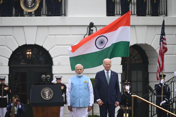 US President Joe Biden and India's Prime Minister Narendra Modi listen to the national anthems during a welcoming ceremony for Modi on the South Lawn of the White House in Washington, DC, on June 22, 2023. (Andrew Caballero-Reynolds/AFP via Getty Images)