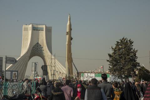 Iranians attend the annual rally commemorating the 1979 Islamic Revolution as domestically built missiles and a satellite carrier are displayed at the Azadi Square in in Tehran, Iran, on Sunday, February 11, 2024. (Photo by Majid Saeedi/Getty Images)
