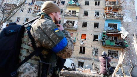 Residents outside a destroyed residential building by artillery in a residential area in Kyiv amid Russian Invasion, in Kyiv, Ukraine, 18 March 2022. (Photo by Ceng Shou Yi/NurPhoto via Getty Images)