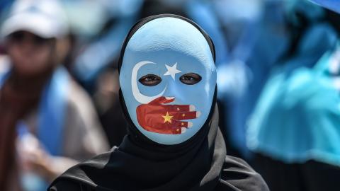 uyghur protestor with mask