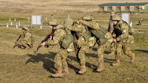 oldiers with the Ukrainian Land Forces conduct squad battle drills
