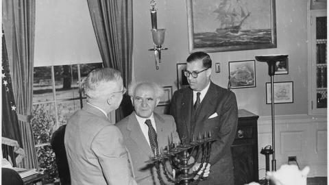 resident Truman in the Oval Office, evidently receiving a Menorah as a gift from the Prime Minister of israel david ben gurion