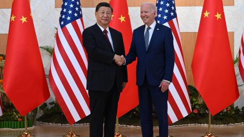 Joe Biden and Xi Jinping shake hands before meeting on the sidelines of the G20 Summit in Bali, Indonesia, on November 14, 2022. (Saul Loeb/AFP via Getty Images)
