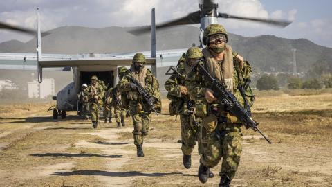 Members of the Japan Ground Self-Defense Force (JGSDF) with 7th Company, 3rd Battalion, 1st Airborne Brigade, disembark an MV-22B Osprey assigned to Marine Medium Tiltrotor Squadron (VMM) 265 during Keen Sword 23 at Camp Ainoura, Japan, Nov. 16, 2022. Keen Sword is a biennial training event that exercises the combined capabilities and lethality developed between the 1st Marine Aircraft Wing, III Marine Expeditionary Force, and the Japan Self Defense Force (JSDF). This bilateral field-training exercise betwe