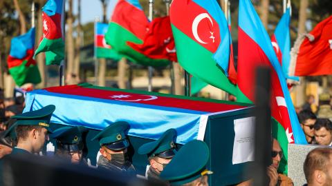 A funeral for 14 Azerbaijani soldiers killed in a helicopter crash held on December 1, 2021, in Baku, Azerbaijan. (Aziz Karimov/Getty Images)