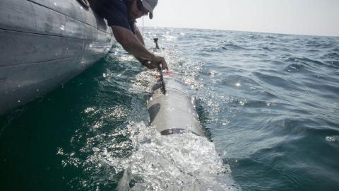 151020-N-JC374-240 ARABIAN GULF (Oct. 20, 2015) Eric Sharp, an unmanned underwater vehicle (UUV) operator assigned to Commander, Task Group (CTG) 56.1, recovers a MK 18 MOD 2 UUV after an operational test. The MK 18 MOD 2 UUV uses side scan sonar to search and discover objects of interest. CTG 56.1 conducts mine countermeasures, explosive ordnance disposal, salvage-diving, and force protection operations throughout the U.S. 5th Fleet area of operations. (U.S. Navy photo by Mass Communication Specialist 3rd