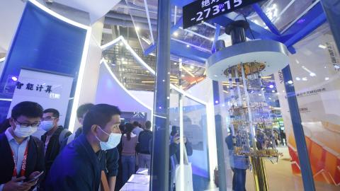 Visitors look at Alibaba DAMO Academy’s core components of quantum computer during the Apsara Conference 2021 on October 19, 2021, in Hangzhou, China. (Photo by Long Wei/VCG via Getty Images)