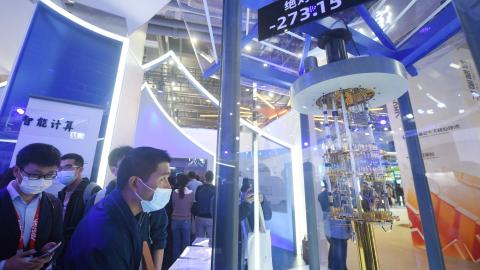 Visitors look at Alibaba DAMO Academy’s core components of quantum computer during the Apsara Conference 2021 on October 19, 2021, in Hangzhou, China. (Photo by Long Wei/VCG via Getty Images)