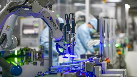 JINHUA, CHINA - FEBRUARY 22: A robotic arm is seen on the assembly line of computer at a computer manufacturing enterprise set up by Tsinghua Tongfang Co., Ltd on February 22, 2022 in Jinhua, Zhejiang Province of China. (Photo by Hu Xiaofei/VCG via Getty Images)