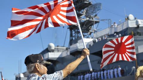 50602-N-IU636-204 PEARL HARBOR (June 2, 2015) A member of the Japanese community in Hawaii welcomes the Japan Maritime Self-Defense Force (JMSDF) ship JS Kashima (TV 3508) as it arrives at Joint Base Pearl Harbor-Hickam. Kashima is joined by JS Yamagiri (DD 152) and JS Shimayuki (TV 3513) for a scheduled port visit. While in Hawaii, JMSDF sailors will participate in wreath-laying ceremonies at the USS Arizona Memorial, National Memorial Cemetery of the Pacific (Punchbowl) and Makiki Cemetery. The JMSDF has 