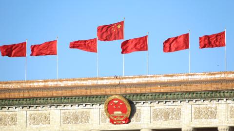 BEIJING, CHINA - OCTOBER 22: Chinese national flags flutter on the Great Hall of the People on October 22, 2022 in Beijing, China. The 20th CPC National Congress concluded on Saturday in Beijing. (Photo by VCG/VCG via Getty Images)