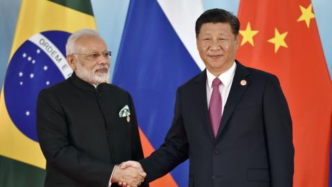 President Xi Jinping (R) and Indian Prime Minister Narendra Modi shake hands before the group photo during the BRICS Summit at the Xiamen International Conference and Exhibition Center in Xiamen, southeastern China's Fujian Province on September 4, 2017. 