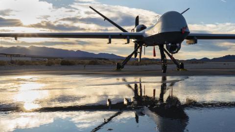 An MQ-9 Reaper is parked on a taxiway during sunset at Creech Air Force Base, Nevada, Nov. 17, 2020. The Reaper is an armed, multi-mission, long-endurance Remotely Piloted Aircraft that is managed and flown by Airmen who provide persistent attack and reconnaissance capabilities to keep our nation safe. (U.S. Air Force photo by Senior Airman Haley Stevens)
