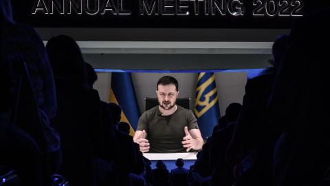 President Volodymyr Zelensky appears on a giant screen during his remote address to the World Economic Forum annual meeting in Davos, Switzerland, on May 23, 2022. (Fabrice Coffrini/AFP via Getty Images)