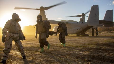 U.S. Marines with 1st Marine Division G-3 Chemical, Biological, Radiological and Nuclear Defense platoon, I Marine Expeditionary Force (MEF), are led to a thorough decontamination station during exercise Steel Knight 23, on Marine Corps Base Camp Pendleton, California, Dec. 7, 2022. 3rd Marine Aircraft Wing (MAW) and 1st Marine Division Marines executed a tactical site exploitation into a potentially contaminated environment. Exercise Steel Knight 23 provides 1st Marine Division and 3rd MAW an opportunity t