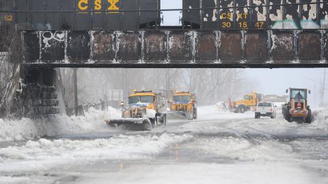 HAMBURG, NY - DECEMBER 24: Plows work to clear ice and snow along the Lake Erie shoreline on December 24, 2022 in Hamburg, New York. The Buffalo suburb and surrounding area was hit hard by the winter storm Elliott with wind gusts over 70 miles per hour battering homes and businesses through out the holiday weekend. (Photo by John Normile/Getty Images)