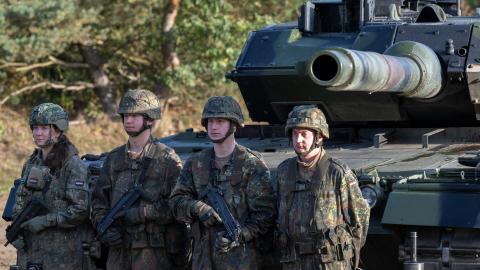 BERGEN, GERMANY - OCTOBER 17: The crew of a main battle tank Leopard 2 waiting for Chancellor Olaf Scholz during a visit at the Bundeswehr army training center in Ostenholz on October 17, 2022 near Hodenhagen, Germany. Scholz has vowed to modernize Germany's armed forces with a special EUR 100 billion budget following Russia's military invasion of Ukraine. (Photo by David Hecker/Getty Images)