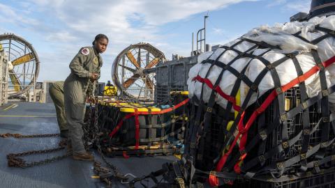 Sailors assigned to Assault Craft Unit 4 prepare material recovered in the Atlantic Ocean from a high-altitude balloon for transport to federal agents at Joint Expeditionary Base Little Creek Feb. 10, 2023. 