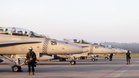 U.S. Marines with Marine Fighter Attack Squadron (VMFA) 312, 2nd Marine Aircraft Wing (MAW), prepare F/A-18 Hornets to take off for flight from Łask Air Base, Poland, April 27, 2022. 2nd Marine Aircraft Wing units are deployed to enhance NATO's capabilities in Eastern Europe at the invitation of the host nation. (U.S. Marine Corps photo by Cpl. Adam Henke)