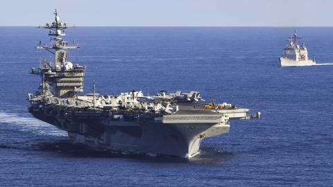 The US Navy aircraft carrier USS Carl Vinson and the Ticonderoga-class guided-missile cruiser USS Lake Champlain transit the South China Sea on November 4, 2021. (US Navy photo by Tyler R. Fraser)