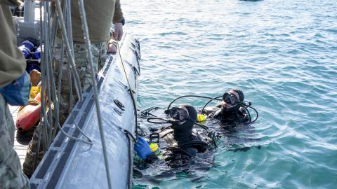 A sailor assigned to Explosive Ordnance Disposal Group 2 conduct pre-dive checks during recovery efforts of a high-altitude balloon in the Atlantic Ocean on February 7, 2023. (US Navy photo by Ryan Seelbach)